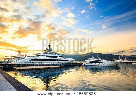 Luxury yacht marina. Port in Mediterranean sea at sunset.