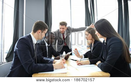 Manager yelling at his employees at the meeting. Company is in recession