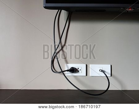 Electrical plug and TV signal outlets on white wall,electronic switch house on white wall - can use to display or montage on product