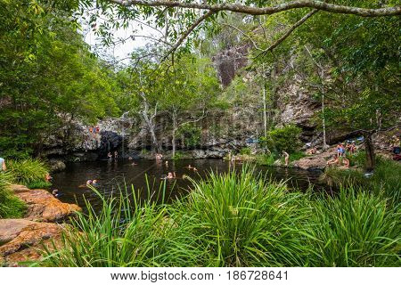Kondalilla Falls, AUS - JAN 21 2017 - People enjoying hot day in rainforest Kondalilla Falls swimming hole, Queensland, Australia