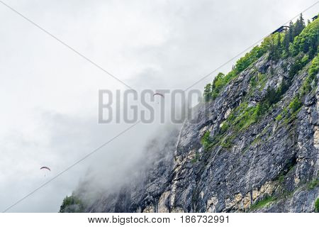 The Swiss Alps at Murren, Switzerland. Jungfrau Region. Tops of the mountains in fog and clouds.