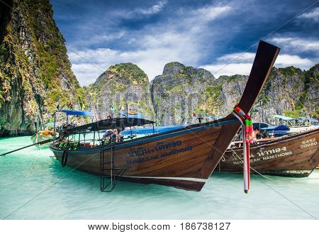 KO PHI PHI LEH, THAILAND, February 1, 2014: Traditional long tail boats on the beach of Maya Bay, Andaman Sea, famous tourist destination in the Ko Phi Phi achipelago