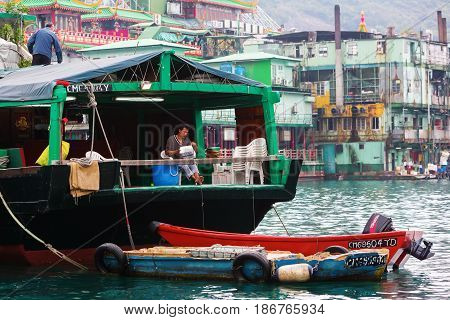 Harbour Scene With Tanka Man In Aberdeen, Hong Kong