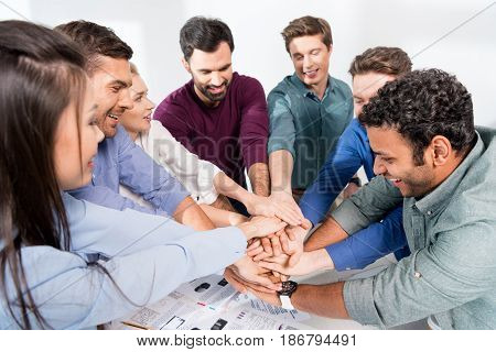 Business Team Giving Highfive Together On Workplace In Office, Young Professional Group Concept
