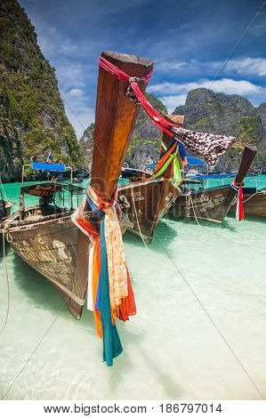 KO PHI PHI LEH, THAILAND, February 1, 2014: Traditional long tail boats on the beach of Maya Bay, Andaman Sea, famous tourist destination in the Ko Phi Phi achipelago