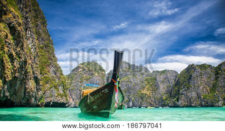KO PHI PHI LEH, THAILAND, February 1, 2014: Traditional long tail boats on the beach of Maya Bay, Andaman Sea, famous tourist destination in the Ko Phi Phi achipelago