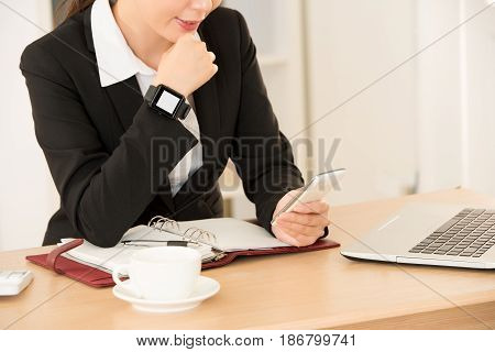 Closeup Of Woman Using 3C Technology Product