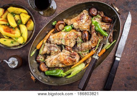 Rabbit with Vegetable and Mushrooms as top view in a Stewpot 