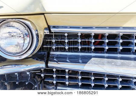 Headlights of a classic or retro car in a car shop