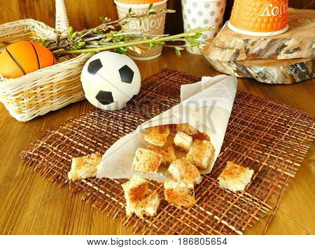 Crispy snacks in a paper bag for a picnic and watching sports matches