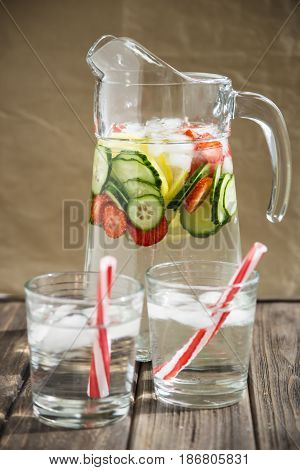 Water with fresh lemon strawberries and cucumber