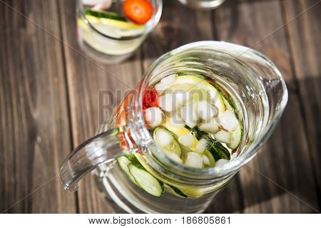 Water with fresh lemon strawberries and cucumber