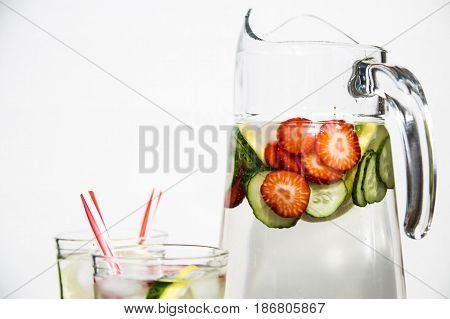 Water with fresh lemon strawberries and cucumber
