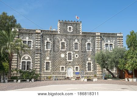 Capernaum, Israel - April 01, 2017 : The main entrance and forecourt of Catholic Franciscan monastery building, built in 1894 in Capernaum (Cafarnaum). near Tiberias, Sea of Galilee, Israel