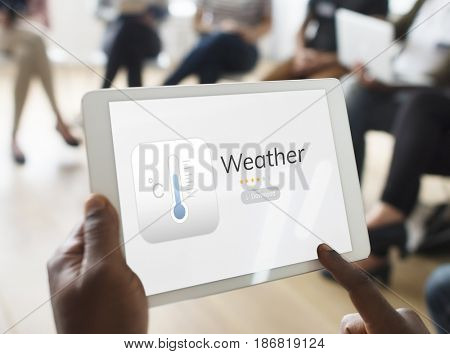 Hands working on digital device network graphic overlay
