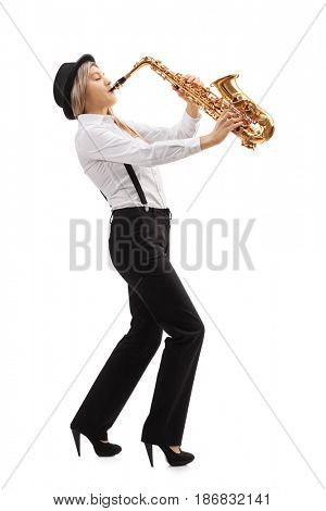 Full length profile shot of a female jazz musician playing a saxophone isolated on white background