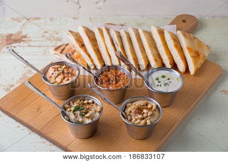 Set Of Appetizers: Hummus, Muhammara, Tirokafteri, Greek Cacik