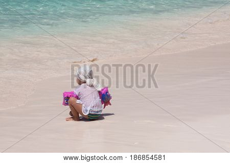 Baby on white sand beach at Phuket , Thailand