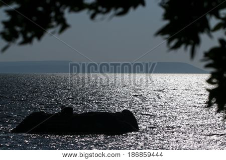 Night view of salt Bafa Lake shore and historical castle ruins. Mugla - Turkey. Sunset.