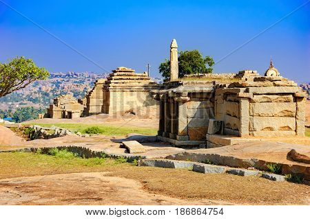View from Hemakuta hill sunset point with ancient ruins, Hampi, Karnataka, India. Landscape with unique mountain formation with amazing stones tropical nature and temple. UNESCO World Heritage Site