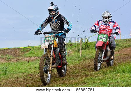 Unidentified Racers Rides A Classic Motorcycle.