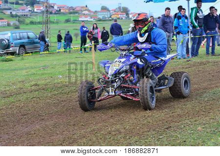Unidentified Racer Rides A Quad Motorbike.