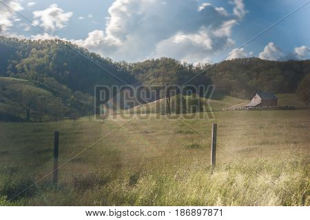 Farm and fence in rural Virginia in late afternoon