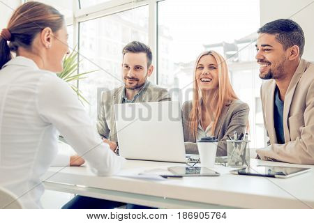 Group of business people having job interview. Young attractive woman during job interview.