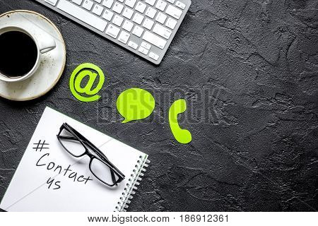 client support service workdesk with contact us mail signs on dark background top view mockup