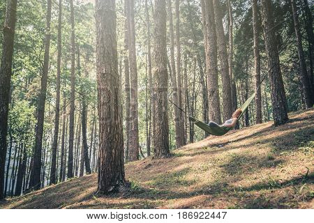 Sleeping woman relax. In the hammock. In the natural atmosphere in the park