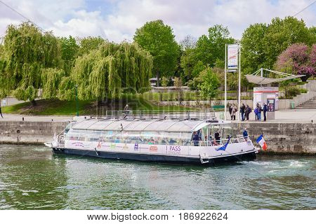 Paris France - May 1 2017: Tourist boat parked at the pier at the Seine River on May 1 2017 at Paris France.
