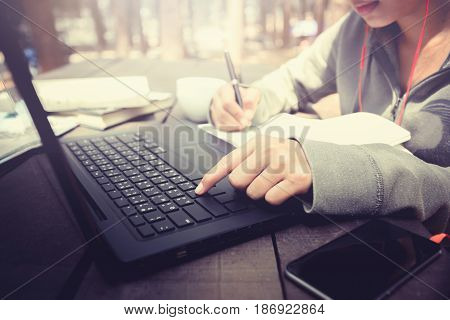 Woman working in a natural garden on vacation.