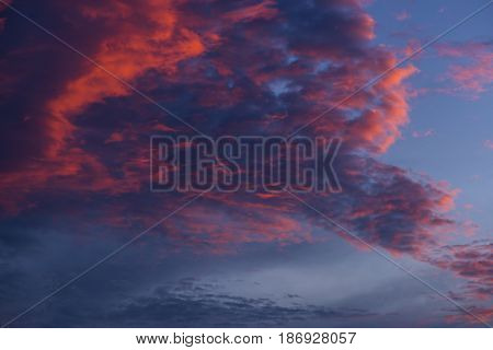 Blue sky with white and blue and pink clouds. Clear sky. Beautiful sky. Evening sky. Yellow and blue cloud in the sky.