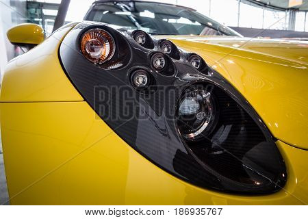 STUTTGART GERMANY - MARCH 03 2017: Headline of the sports car Alfa Romeo 4C Spider (Type 960) 2015. Close-up. Europe's greatest classic car exhibition 