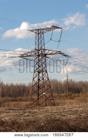 High-voltage Electric Main Against The Dark Blue Sky