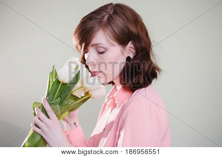 Girl holding tulips. Beauty, pink and tenderness