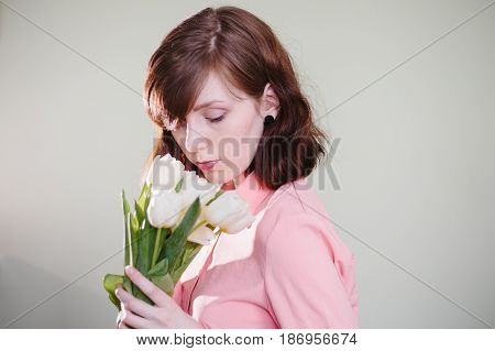 Girl holding tulips. Beauty, pink and tenderness