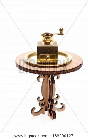 Coffee Grinder , Antique Vintage Brass Ware On Decorative Wooden Table