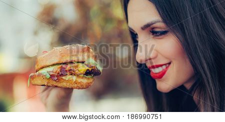 Happy Young Woman Eat Tasty Fast Food Burger