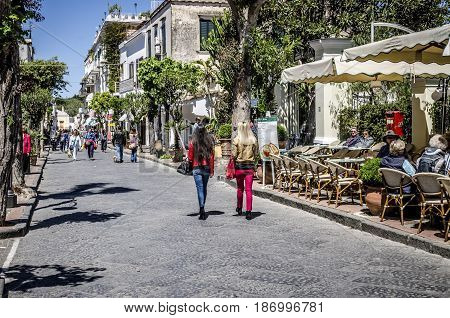 Ischia, ITALY - April 29: Street scene with hotel and shops in Ischia Italy in Spring. Ischia is located in the Gulf of Naples and is an important tourist destination.
