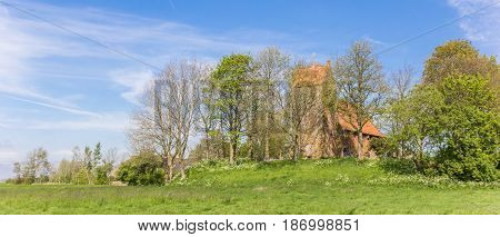Panorama Of Medieval Church In Historic Village Oostum