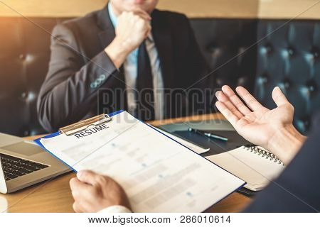 Job Interview Concept , Senior Manager Reading A Resume During A Job Interview Employee Young Man Me