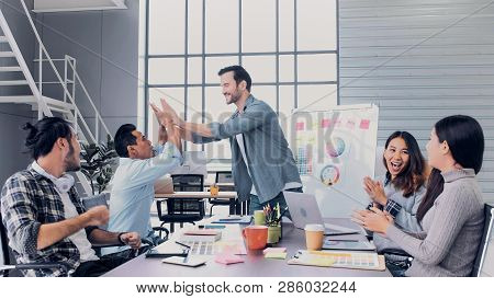 Creative Director Team Lead Clap Hand With Designer Team At Meeting Table.discussion Idea In Creativ