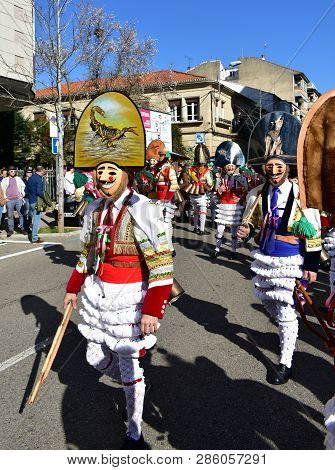 Verin, Spain, 24 Feb 2019. Famous Carnival And Street Parade With Cigarrons Costumes. Ourense Provin