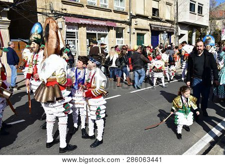 Verin, Spain, 24 Feb 2019. Famous Carnival And Street Parade With Cigarrons Costumes. Ourense Provin