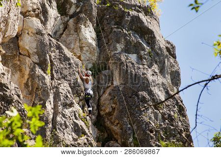 Doberdo, Italy - April, 22: View Of A Passionate Female Climber On Doberdo Crag On April 22, 2018