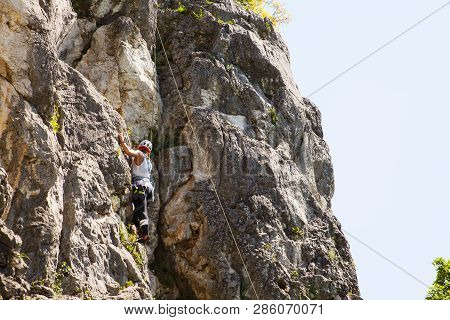 Doberdo, Italy - April, 22: View Of A Passionate Female Climber On Doberdo Crag On April 22, 2018