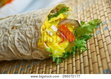 Paneer Kathi Rolls,  Paneer Tikka Cubes  Top With The Veg Salad.