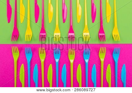 Many Color Plastic Cutlers On A Bright Background