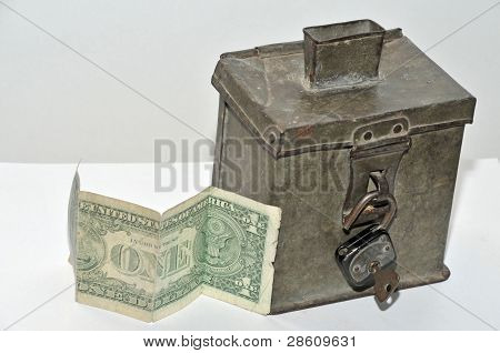 old steel money box with padlock and dollar